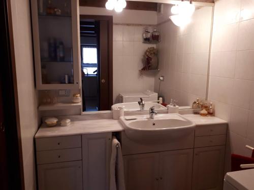 a bathroom with a sink and a mirror at Borgo incantato in Villar Dora