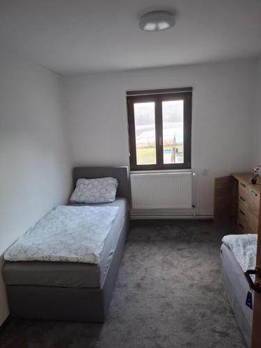 Postel nebo postele na pokoji v ubytování Stará Pošta