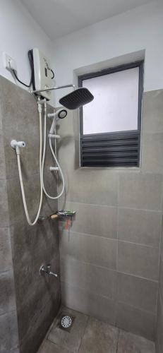 a shower in a bathroom with a window at Sky Apartment Viyathpura Colombo in Sri Jayewardenepura Kotte
