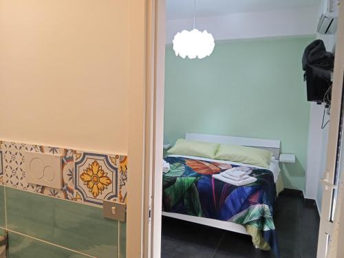 Ένα ή περισσότερα κρεβάτια σε δωμάτιο στο B&B La Fenice
