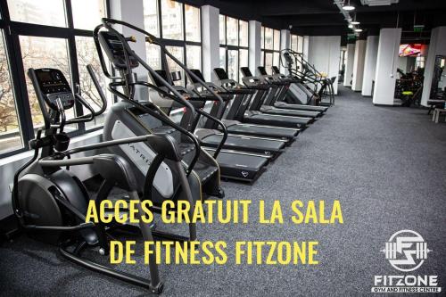 a row of tread machines in a gym at Adrian Home Delice in Ploieşti