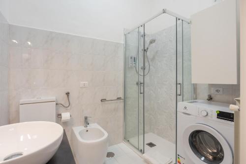 a bathroom with a toilet sink and a shower at Giufrania Suite in Castellammare di Stabia
