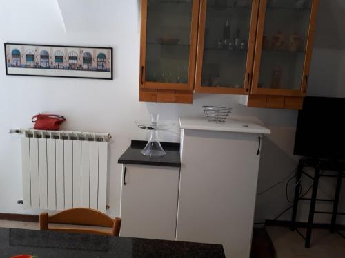 a kitchen with a counter with a wine glass on it at borgo romantico in Villar Dora