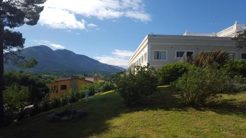 a white building with a view of a mountain at Montecassino in Capilla del Monte