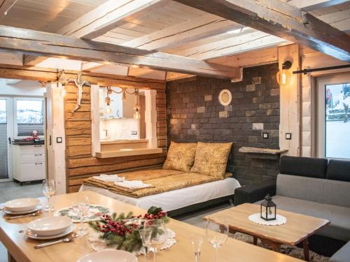 a living room with a couch and a table at Domek U Babci in Istebna