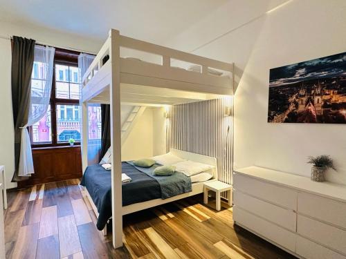 a bedroom with a bunk bed in a room at Elly Modern Oldtown Apartments in Prague