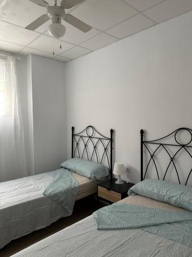 Ένα ή περισσότερα κρεβάτια σε δωμάτιο στο Apartamento Valencia 17