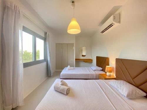 Ένα ή περισσότερα κρεβάτια σε δωμάτιο στο Hotel apartment swan lake