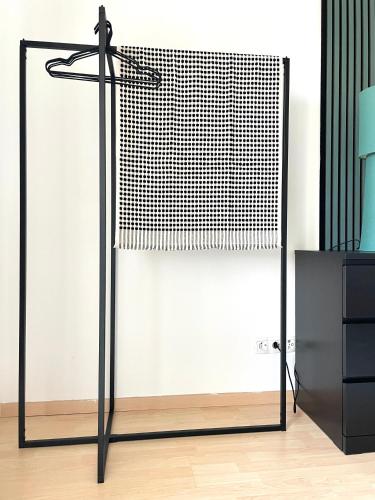 a black metal closet with a glass door at Anne in Sankt Pölten