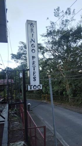 a sign for a hotel on the side of a street at Gringo Petes Too in Fortuna