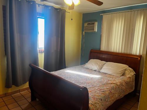 a bedroom with a bed and a window at Casa de al lado - 2 bedroom house w/ bonus bunkhouse! in San Felipe
