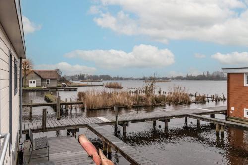 a view of a body of water with a dock at Spacious 120m2 Water Villa With Sauna Near Amsterdam in Aalsmeer