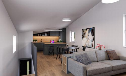 ein Wohnzimmer mit Couch und Küche in der Unterkunft Apartmány Pasohlávky pod Římským vrchem in Pasohlávky