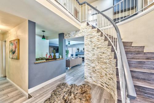 a staircase in a home with a stone wall at Treasure Bay-3BR Pool & Hot Tub Oasis Near T Strip in Las Vegas