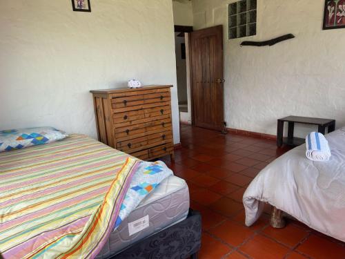 Postel nebo postele na pokoji v ubytování Hotel Campestre Casa Jaz