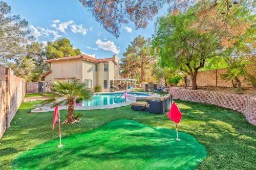 a yard of a house with a putting green at Treasure Bay-3BR Pool & Hot Tub Oasis Near T Strip in Las Vegas