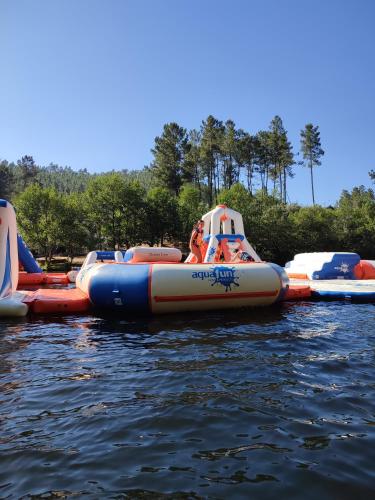 a group of inflatable tubes on the water at Casa Iris Cunqueiros in Sobreira Formosa
