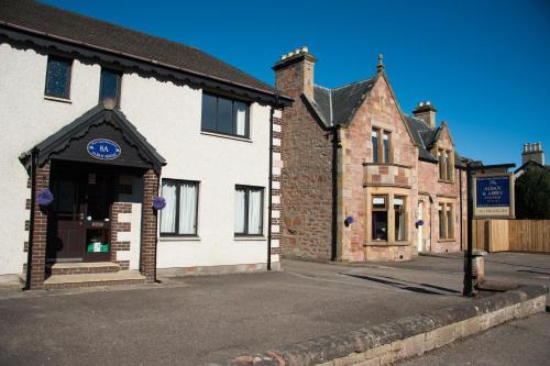 a building on the side of a street at Alban and Abbey House in Inverness