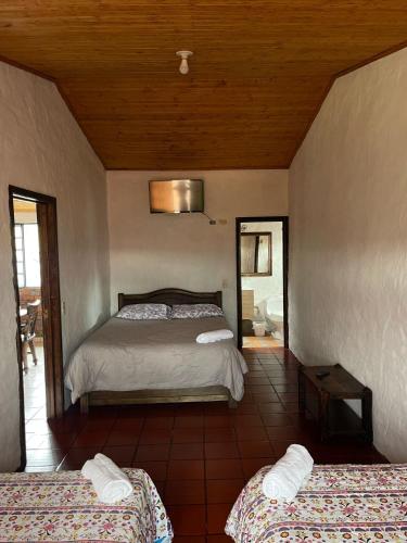 Una cama o camas en una habitación de Hotel Campestre Casa Jaz