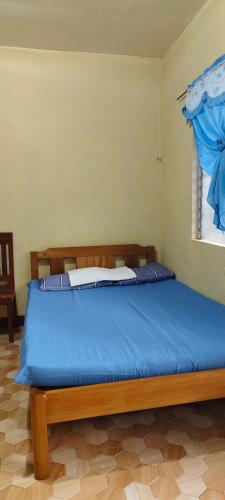 Katil atau katil-katil dalam bilik di Macabuag Apartment