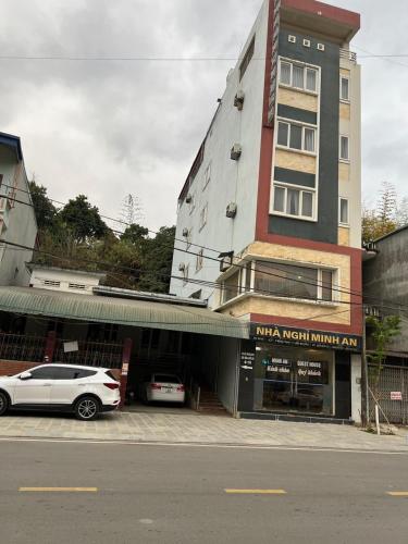 a white car parked in front of a building at Minh An in Dien Bien Phu