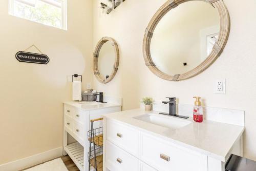 a bathroom with a sink and a mirror at The Riverscape at Gruene in New Braunfels