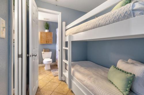 a bedroom with a bunk bed with a toilet at Gulf Place Cabanas in Santa Rosa Beach
