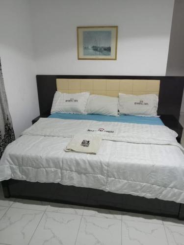 Postel nebo postele na pokoji v ubytování MT4 Hotel