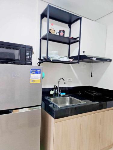 Η κουζίνα ή μικρή κουζίνα στο Our Happy Place - Cheer Residences