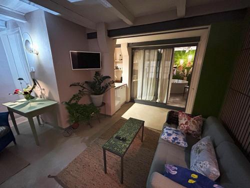 a living room with a couch and a table at Nel mio immaginario in Città della Pieve