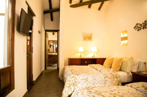 Letto o letti in una camera di Santa Lucía Casa Hotel