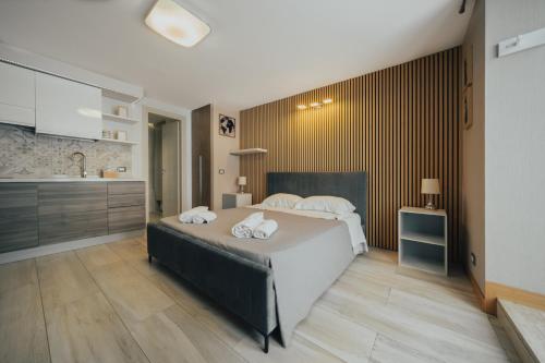 A bed or beds in a room at Catanese Proverb's House - Via Napoli - Ground Floor