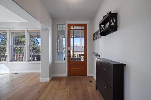 a living room with a door and a wooden floor at Flagline Trail in Bend