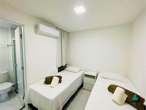a hospital room with two beds and a toilet at Aquarius Style by Holiday Stays in Fortaleza