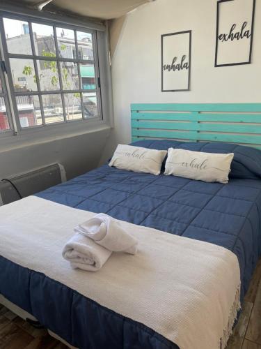 a bedroom with two beds with towels on them at Arenales 2111 Recoleta in Buenos Aires