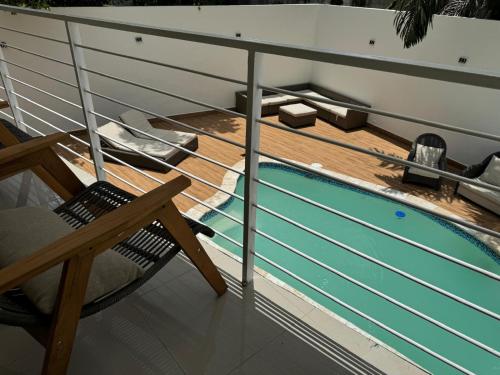 a deck with a swimming pool on a cruise ship at Solano Apartamentos in Boca Chica