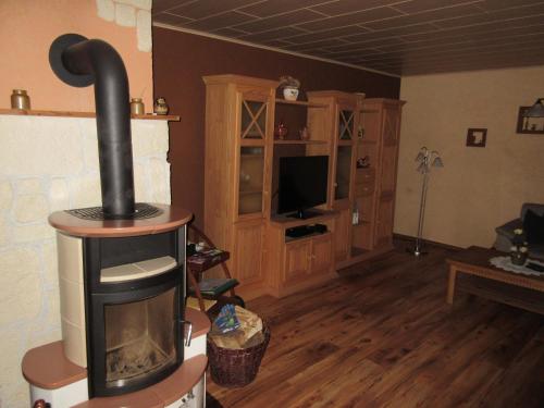 a living room with a wood burning stove at Ferienhaus Schulze in Schierke