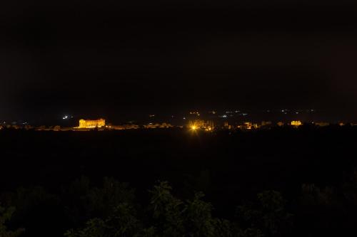 a view of a city at night with lights at Hotel Foresteria Baglio Della Luna in San Leone