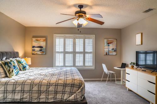 a bedroom with a bed and a ceiling fan at Pool House, Short Drive to Beach, Grill, Smart TV in Navarre