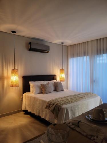 Ένα ή περισσότερα κρεβάτια σε δωμάτιο στο Cipó Lofts - Serra do Cipó