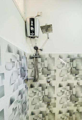 a room with a wall covered in tiles at Villa 10 Weligama in Weligama