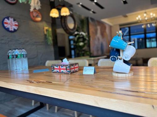 a table with a coffee maker on top of it at Villa Ten - Swing screw in Guilin