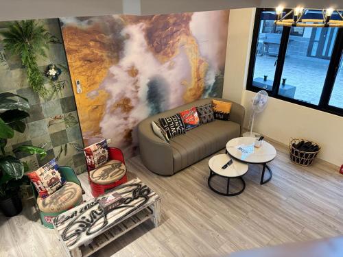 a living room with a couch and a table at Villa Ten - Swing screw in Guilin