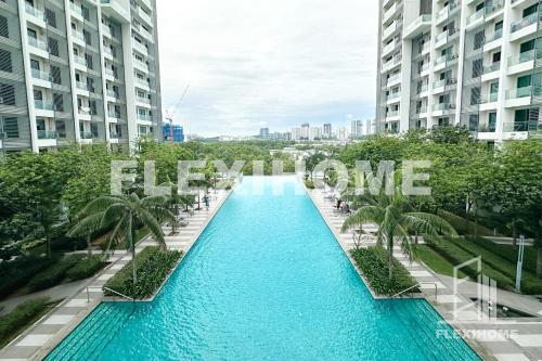 a swimming pool in the middle of two tall buildings at FREE Streaming Services-Designed Studio Home at Cybersquare, Cyberjaya by Flexihome-MY in Cyberjaya