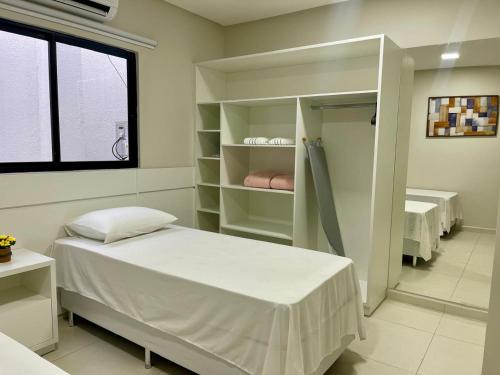 Postel nebo postele na pokoji v ubytování FLAT's TAVARES 201