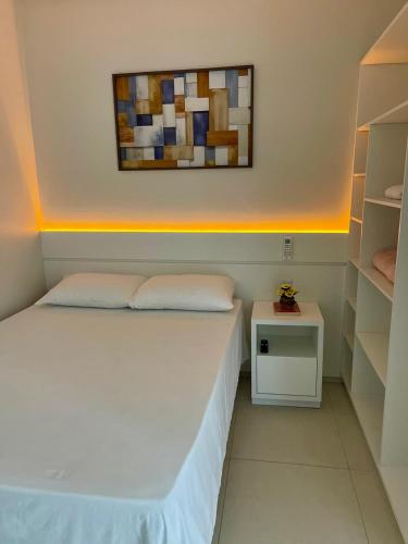 Postel nebo postele na pokoji v ubytování FLAT's TAVARES 201