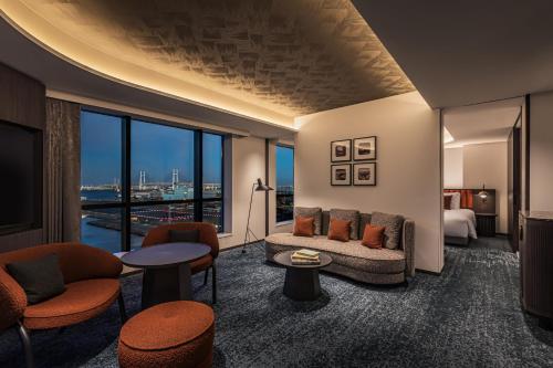 a hotel room with a view of a city at The Gate Hotel Yokohama by Hulic in Yokohama