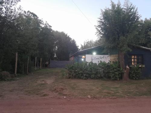 a house with a sign on the side of it at Casa Azul in Villa del Dique