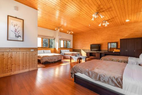 Una cama o camas en una habitación de Cingjing Morning Star