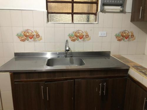 Kuchyň nebo kuchyňský kout v ubytování Apartamentos contiguos cerca a Parque de Bello Antioquia